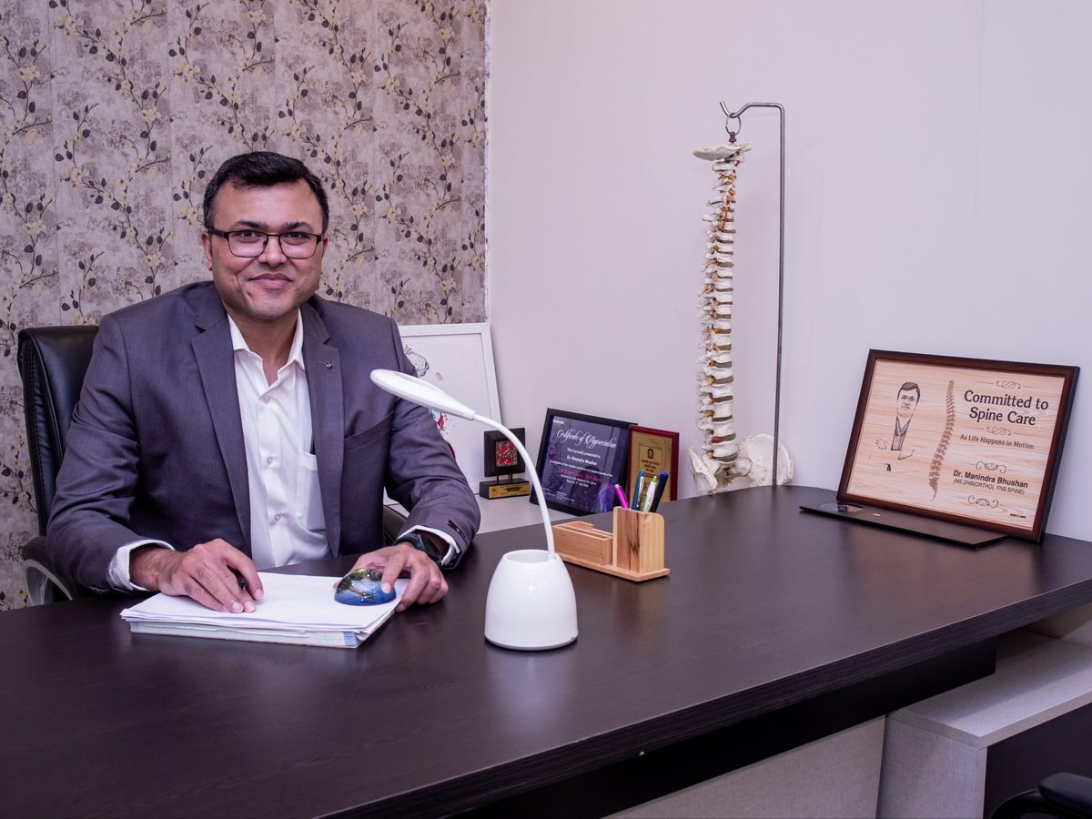 Dr. Manindra Bhushan, Consultant Spine Surgeon, in his consulting room in Raipur